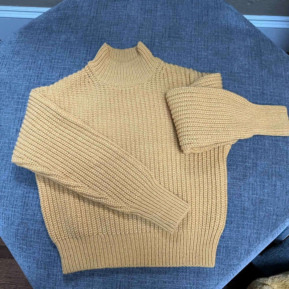 Uniqlo XS sweater. This has never been worn but tags are removed.